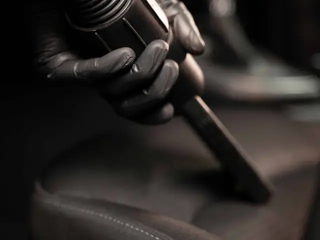 Vacuuming a car seat